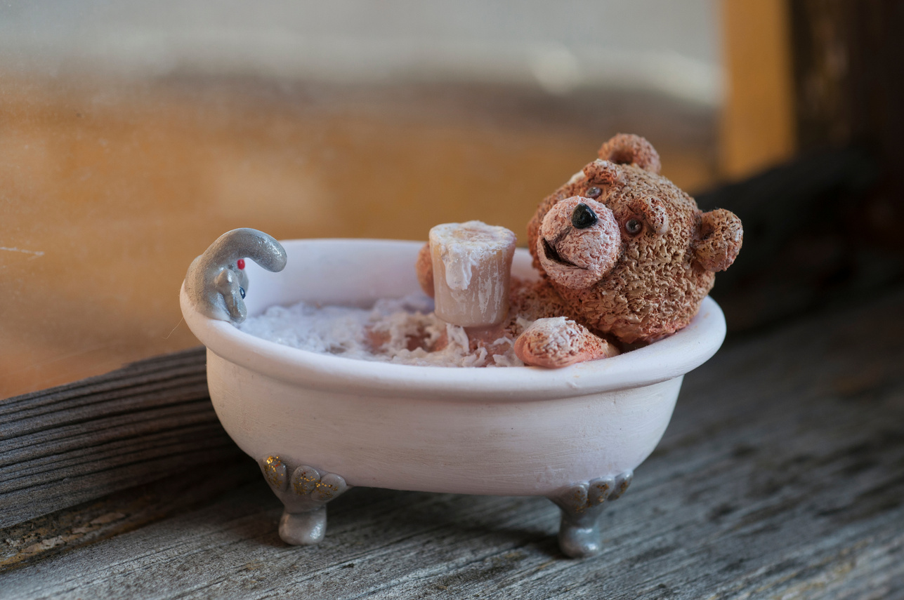 Teddy bear taking bath